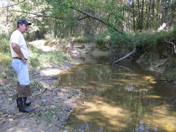 4---Derek-assesses-erosion-on-the-left-bank